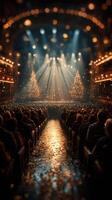 Crowd at a festive theater performance with bright lights and decorated trees during the holiday season photo