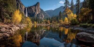 Vibrant autumn landscape with waterfall and forest reflection in Yosemite National Park during midday photo