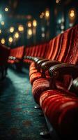 Elegant red theater seats arranged in a cozy vintage venue illuminated by soft lights photo