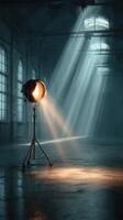 Dramatic lighting in an abandoned warehouse with rays of sunlight illuminating the dusty floor photo