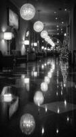 Elegant hotel hallway decorated for the holidays with shimmering lights and a Christmas tree photo