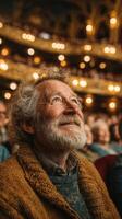 Elderly man experiencing joy during a live performance in a grand theater filled with an attentive audience photo