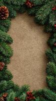 Festive holiday decoration featuring evergreen branches and pine cones on a textured background photo