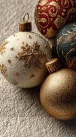 Elegant Christmas ornaments in gold and silver colors arranged on soft fabric background photo