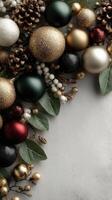 Christmas ornaments and greenery arranged elegantly on a light surface for festive decoration photo