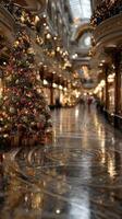 Elegant holiday decorations illuminate grand shopping hall filled with festive spirit and gleaming reflections photo