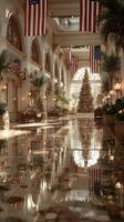 Elegant holiday decorations in a grand hotel lobby with Christmas tree and American flags photo