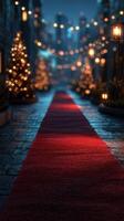 Festive red carpet lined with glowing lanterns and Christmas trees in a cozy urban street at night photo