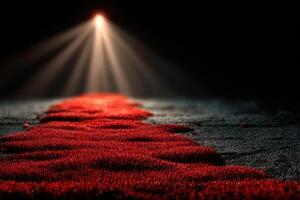 Creative display of red textured surface under dramatic lighting in dark setting photo
