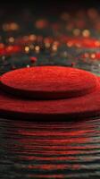 Elegant red display set on a textured black surface with sparkling decorations at an evening event photo