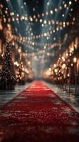Elegant red carpet pathway adorned with festive lights and Christmas trees during a glamorous evening event photo