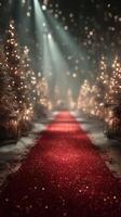 Sparkling red carpet pathway lined with festive trees and soft lights in a serene winter setting at night photo