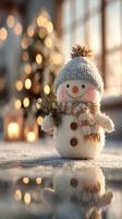 Charming snowman adorned with a hat and scarf in a cozy winter setting by a Christmas tree photo