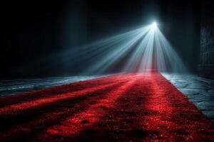 Red carpet leading into a dimly lit space with dramatic lighting effects creating an artistic atmosphere photo