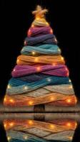 Creative display of colorful thread forming a festive Christmas tree with lights at night photo