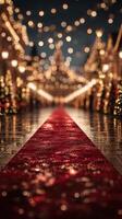 Festive holiday walkway adorned with glittering lights and red carpet in a vibrant Christmas market at night photo