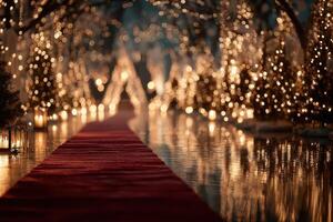 Elegant outdoor ceremony setup illuminated by string lights and candles for a romantic evening event photo