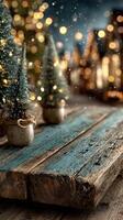 Winter festive decor with miniature trees and soft twinkling lights on a rustic wooden table photo