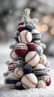 Winter-themed decorative tree made of baseballs and knit ornaments in a snowy setting photo
