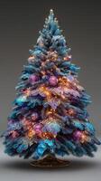Beautifully decorated Christmas tree with blue and purple ornaments glowing with lights photo