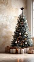 Elegant Christmas tree adorned with ornaments and gifts in a cozy indoor setting photo