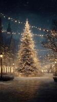 City square illuminated by festive lights and a giant Christmas tree during a snowy evening in winter photo