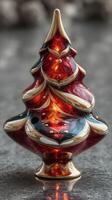 Beautifully crafted glass Christmas tree ornament glowing in soft light during the festive season photo