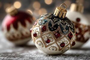 Beautiful hand-painted Christmas ornaments with intricate details and sparkling accents on a blurred festive background photo