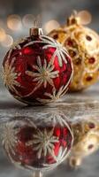 Brightly colored Christmas ornaments reflecting on a smooth surface during the holiday season photo