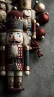 Colorful nutcracker figures and Christmas decorations on a textured surface during the holiday season photo