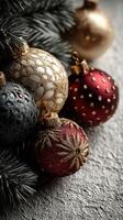 Decorative Christmas ornaments in rich colors rest amongst tree branches for holiday celebrations photo