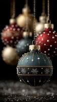 Colorful holiday ornaments hanging on a black background create a festive atmosphere in a cozy winter setting photo