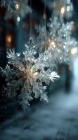 Sparkling snowflakes hang delicately in a winter wonderland at night, illuminating the quiet street with soft light photo