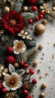 Colorful holiday decoration with red flowers, gold ornaments, and festive greenery arranged on a textured background photo