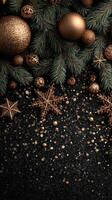 Elegant gold and black Christmas decorations arranged beautifully on a dark surface with festive ornaments and greenery photo