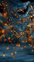 Elegant string lights illuminate a serene outdoor setting during twilight hours with a warm, inviting glow photo