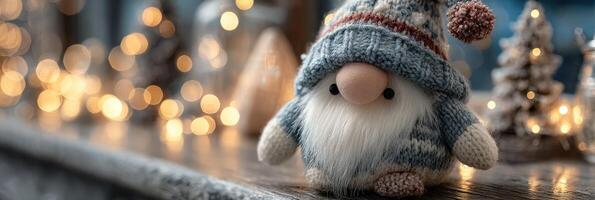 Cute winter gnome figurine wearing a knitted hat surrounded by festive decorations and warm lights photo