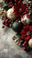 Decorative holiday ornaments and flowers arranged on a textured surface during the festive season photo