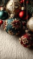Holiday ornaments in vibrant colors with intricate designs hanging on a soft textured surface photo