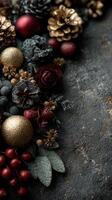 Colorful holiday floral arrangement with rich textures and ornaments displayed on a dark surface in winter photo
