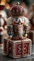 Colorful nutcracker figurine sits atop a decorated gift box in a festive winter setting photo