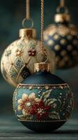 Decorative holiday ornaments showcasing intricate floral designs and rich colors hanging against a dark background photo