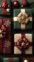 Christmas presents arranged with decorative bows and ornaments in festive colors on a dark green background photo