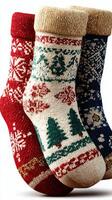 Colorful knitted holiday socks in festive patterns displayed together for winter decoration and cozy vibes photo