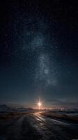 Bright star shining over a winding road under a starry night sky in a tranquil landscape at dusk photo