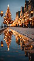 Holiday lights reflect on a cobblestone street beside an illuminated Christmas tree at dusk in a festive town square photo