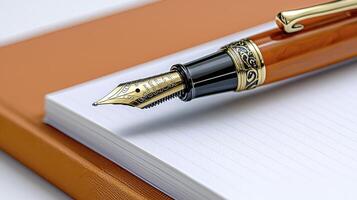 Elegant fountain pen poised above a crisp white notebook ready for a creative writing session with ink flow photo