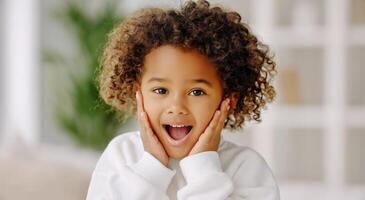 A young child with an open mouth and a surprised look photo