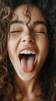 A woman with her mouth open and her tongue out photo