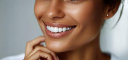 A woman with white teeth smiling photo